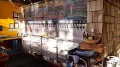 there are many beer taps lined up on the wall in this barbeque room