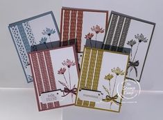 four cards with different designs on them, one has a bow and the other has flowers