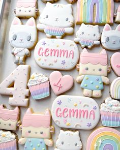 decorated cookies in the shape of animals and rainbows