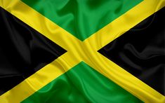 the flag of jamaica is waving in the wind and it looks like it's made out of silk