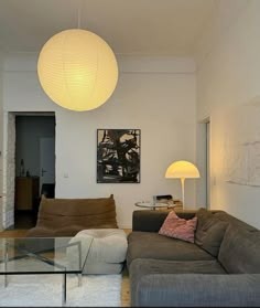 a living room filled with furniture and lamps