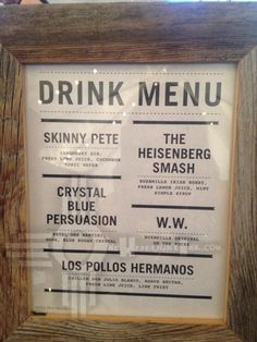 the menu for drink menus is displayed in a wooden frame