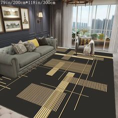 the living room is decorated in black, gold and gray colors with an area rug