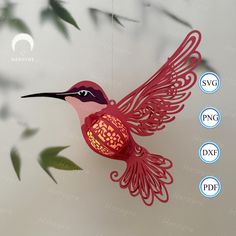 an ornament shaped like a humming bird with wings and flowers on it's back