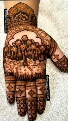 henna designs for hands and feet with different patterns on the hand, which are also decorated