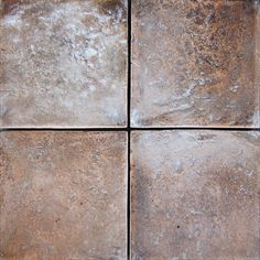 four square brown tiles with white stains on them