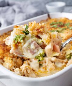 a spoonful of chicken casserole with broccoli and cheese