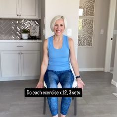 an older woman sitting on a chair in a kitchen