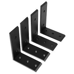 three black metal brackets on a white background