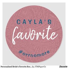 a round sticker with the words cayla's favorite in white ink