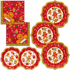 four red plates with gold trim and ginger cookies on them, all decorated in different designs