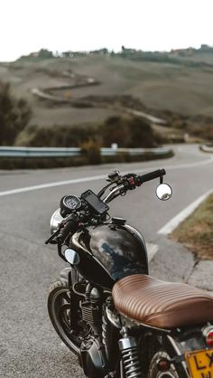 a motorcycle is parked on the side of the road