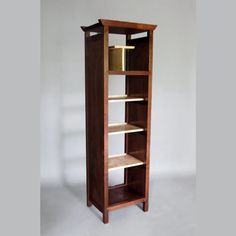 a tall wooden shelf with shelves on each side