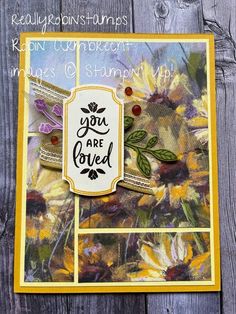 a card with sunflowers on it and the words you are loved written in black ink