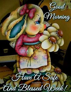 a card with an image of a bunny holding flowers and saying good morning have a safe and blessed week