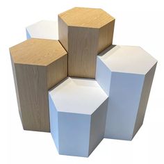 three hexagonal boxes are stacked on top of each other, one is white and the other is brown