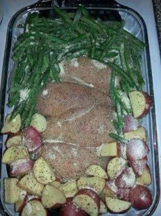 potatoes, green beans and meat in a casserole dish with seasoning on top