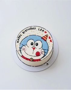 a birthday cake with an image of a cat on it