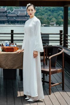 Expertly crafted and designed, the Ao Dai is made of luxurious synthetic silk for a comfortable yet elegant fit. The floor-length design and flare sleeves make it a perfect choice for any formal occasion. Elevate your style and feel confident in this stunning Vietnamese traditional garment. Length:- Ao Dai: 125cm/130cm/135cm (S/M/L)- Pants: 100cm/104cm/108cm (S/M/L) *Including pants of the same color as the photo. Ao Dai Pattern, Homemade Clothing, Mean Blvd, Flare Sleeves, Flat Iron, White Patterns, Flared Sleeves, Feel Confident, Designer Collection