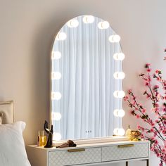 Step into the spotlight with the Cooper & Co. Collingwood LED Arched Vanity Mirror. This medium-sized, arch-shaped mirror is a must-have tool for any makeup aficionado or beauty maven. Crafted with finesse and functionality in mind, it is adorned with 15 radiant LED lights, engineered to emulate professional studio lighting right at your vanity. Creating the ideal ambiance for your beauty routine has never been easier. Each LED bulb offers adjustable brightness that can be effortlessly dimmed to achieve the perfect illumination level for any occasion - from a day look for a sunny brunch to a glamorous evening makeup look. The Cooper & Co. Collingwood LED Arched Vanity Mirror also features three unique color light settings: a crisp, invigorating white, a soothing, warm yellow, and a balance Arched Vanity Mirror, Flawless Makeup Application, Evening Makeup, Mirror Shapes, Warm Yellow, Step Lighting, Australia Living, Studio Lighting, Home Decor Mirrors