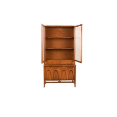 a wooden cabinet with two doors open on the top and bottom, in front of a white background