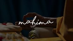 the word mahina written in white on a photo of someone's hands