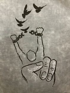 a t - shirt with a drawing of a person raising their hands