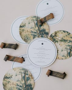 the wedding stationery is laid out on top of each other