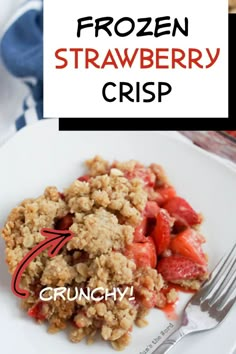 a white plate topped with strawberry crisp next to a fork