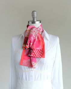 "Make a bold, happy statement with this soft oblong chiffon scarf. Style it around your neck or in your hair. Find styling examples in the last photo. Ready to ship and comes nicely wrapped in our gift-ready faces print cotton pouch. They are constructed entirely by hand with love and attention to every detail.  color mix I've got all the hottest pinks covered in this print with a salmon pink side stripe and a few colorful jewel tones mixed in. size + details 10 x 54 inches long (26mm x 137mm) shown on a 13\"/33mm (size 10) mannequin neck more details + carefully stitched in two layers of super-soft airy chiffon polyester + two-sided closed-seam construction, completely handmade + easy to style, wrinkle-free + small C.Banning logo shows on one side + comes nicely wrapped in a fun faces pri Chic Pink Scarf As Gift, Pink Feminine Silk Scarf, Chic Pink Scarves For Spring, Pink Silk Scarf For Spring, Pink Silk Scarf For Summer, Pink Silk Scarf For Summer Gift, Pink Scarves For Summer Gifts, Pink Scarf As Summer Gift, Pink Scarf For Spring Gift