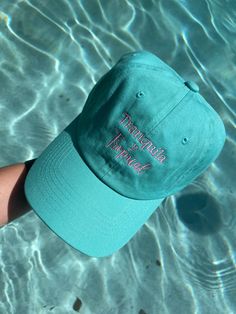 Tranquila y Tropical dad hat. Teal dad hat, light pink embroidered letters. 100% cotton, Adjustable closure. One size fits most. Trendy Cotton Hat For Vacation, Trendy Cotton Dad Hat For Vacation, Trendy Dad Hat For Vacation And Spring, Trendy Dad Hat For Spring Vacation, Spring Vacation Dad Hat, Summer Cotton Dad Hat With Curved Bill, Pink Curved Brim Dad Hat For Summer, Spring Vacation Dad Hat Cap, Spring Vacation Dad Cap