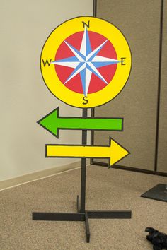 a sign with arrows pointing in different directions