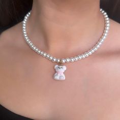 This dainty jewelry gift for her features a minimalist teddy bear charm on a white pearl necklace, perfect for women who adore teddy bears.🧸  𝐃𝐄𝐓𝐀𝐈𝐋𝐒:  ⭐️ Pearl Necklace length is 14 inches & includes a 2 inch extender  ⭐️ Teddy Bear Pendant size is 5/8 x 3/4 ⭐️ Includes glass pearls, gold stainless steel clasp & a fuzzy, soft white teddy bear charm  ⭐️ coquette styled pearl necklace, white fuzz on teddy bear charm will preserve white only with proper care ⭐️ ALL jewelry include 1 year w White Teddy Bear, Bear White, White Pearl Necklace, Bear Pendant, Pearl Jewelry Necklace, Necklace White, Polish Jewelry, Dainty Jewelry, Jewelry For Women