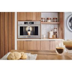 a microwave oven sitting on top of a wooden counter