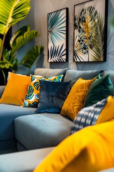 a living room filled with lots of furniture and plants on the wall behind it is a blue couch covered in colorful pillows