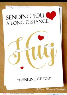 a greeting card with the words sending you a long distance hug and hearts on it