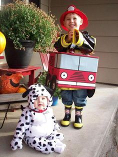 two children dressed up as dalmatian and firetruck on the front porch