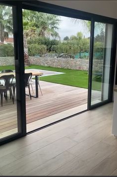 an open kitchen with sliding glass doors leading outside