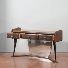 a wooden desk with two drawers on it