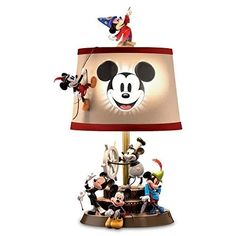 a lamp with mickey mouse and other disney characters on it