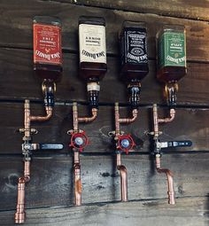 there are many different types of beer on the wall in this room with pipes and faucets