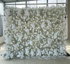 a large white flowered wall in front of a window