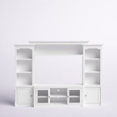 a white entertainment center with shelves and cupboards on each side, against a plain background