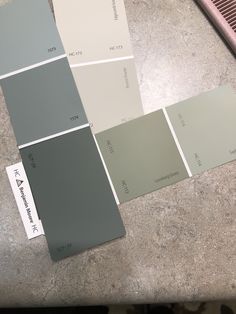 several different shades of paint sitting on top of a counter