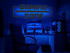 a computer desk with a gaming zone sign above it and a chair in front of it