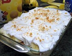 a cake sitting on top of a pan covered in frosting