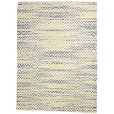 a yellow and blue rug on a white background with an area rug in the shape of a zigzag pattern