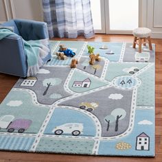 a child's rug with cars, trucks and houses on it in a living room