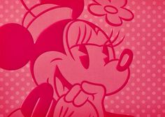 an image of minnie mouse with flowers on it's head and polka dot background