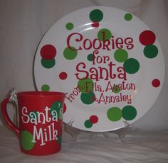 a plate and mug sitting on a bed with the words cookies for santa written on it